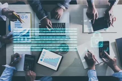 Multiple hands working at a desk